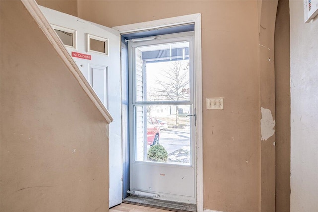 doorway to outside featuring light hardwood / wood-style flooring