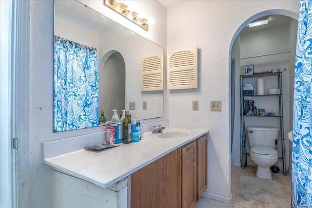 bathroom with vanity and toilet