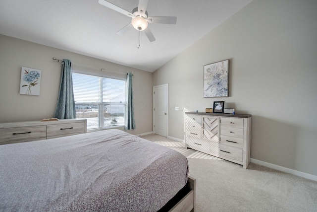 bedroom with lofted ceiling, light colored carpet, and ceiling fan