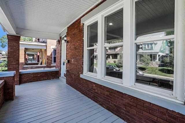 wooden terrace featuring a porch