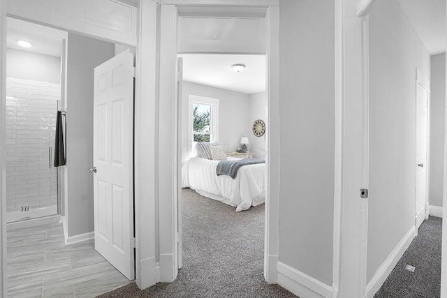 corridor with light colored carpet