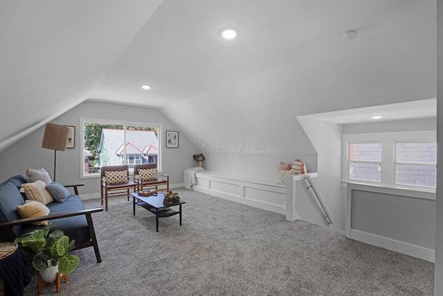 interior space with lofted ceiling and carpet floors