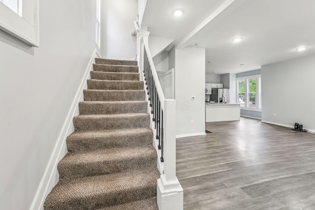 392 Morrison Ave, Columbus, OH 43205 - stairs with wood finished floors, recessed lighting, and baseboards
