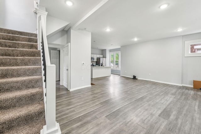392 Morrison Ave, Columbus, OH 43205 - unfurnished living room with wood finished floors, stairway, recessed lighting, and baseboards