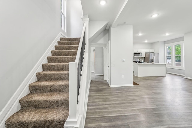 392 Morrison Ave, Columbus, OH 43205 - stairs featuring wood finished floors, recessed lighting, and baseboards