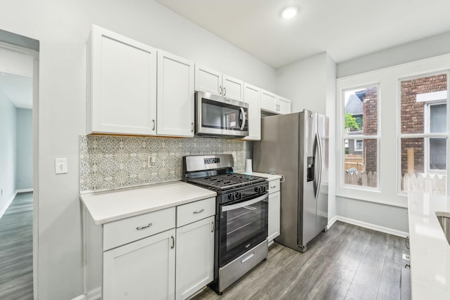 392 Morrison Ave, Columbus, OH 43205 - kitchen with appliances with stainless steel finishes, baseboards, light countertops, wood finished floors, and decorative backsplash