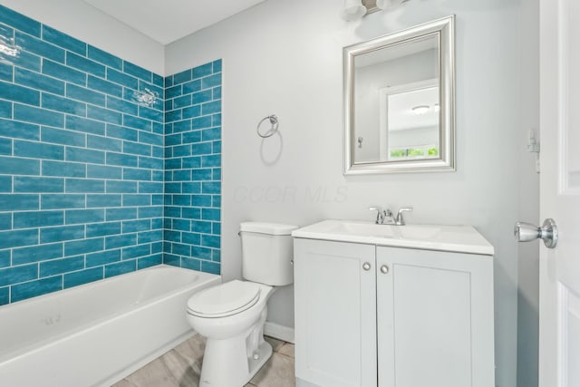 392 Morrison Ave, Columbus, OH 43205 - bathroom with vanity, toilet, bathtub / shower combination, and baseboards