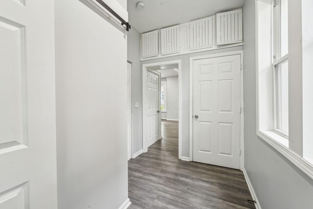 392 Morrison Ave, Columbus, OH 43205 - hall featuring baseboards, wood finished floors, and a barn door