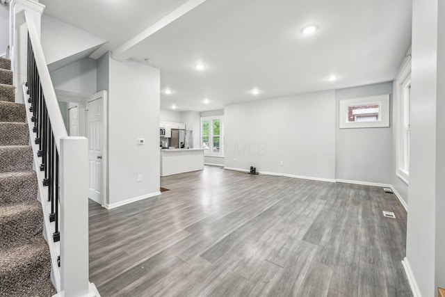 392 Morrison Ave, Columbus, OH 43205 - unfurnished living room featuring stairs, recessed lighting, dark wood finished floors, and baseboards