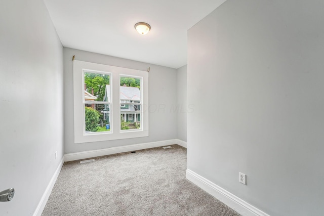 392 Morrison Ave, Columbus, OH 43205 - carpeted empty room featuring baseboards