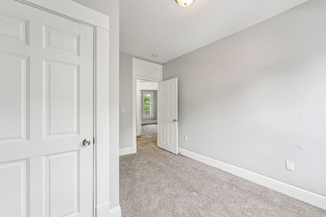 392 Morrison Ave, Columbus, OH 43205 - unfurnished bedroom featuring light carpet and baseboards