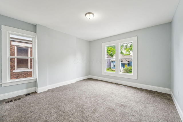 392 Morrison Ave, Columbus, OH 43205 - carpeted empty room featuring baseboards
