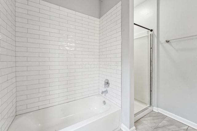 392 Morrison Ave, Columbus, OH 43205 - full bathroom featuring marble look tile flooring and baseboards