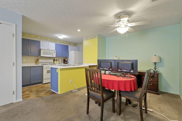 dining space featuring ceiling fan, carpet flooring, and a textured ceiling