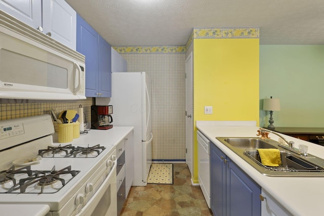 kitchen with blue cabinetry, sink, a textured ceiling, and white appliances