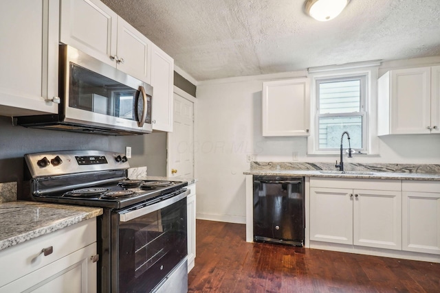 kitchen featuring white cabinetry, light stone countertops, dark hardwood / wood-style flooring, and stainless steel appliances