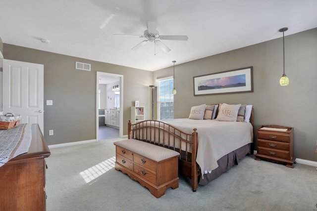 carpeted bedroom featuring ceiling fan and connected bathroom