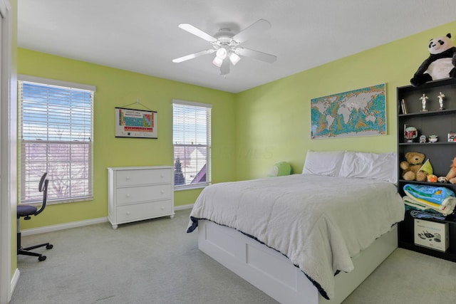 bedroom featuring ceiling fan and light colored carpet