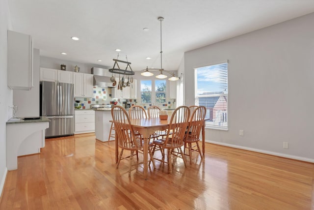 dining area with light hardwood / wood-style floors