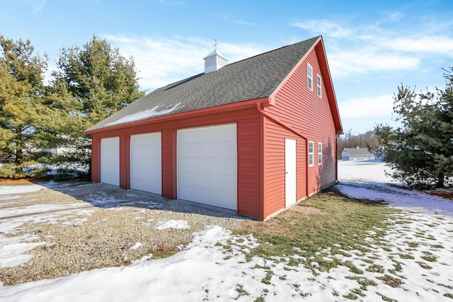 view of snow covered garage