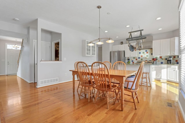 dining area with light hardwood / wood-style flooring