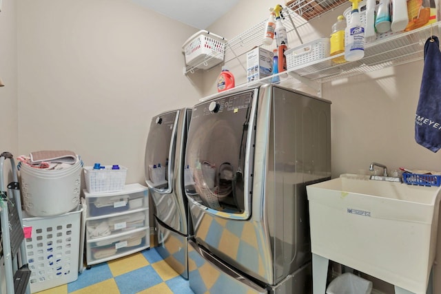 laundry room featuring separate washer and dryer and sink