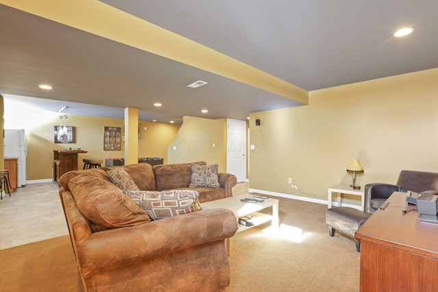 living room with bar and light carpet