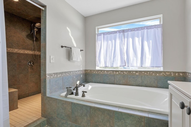 bathroom featuring vanity and separate shower and tub