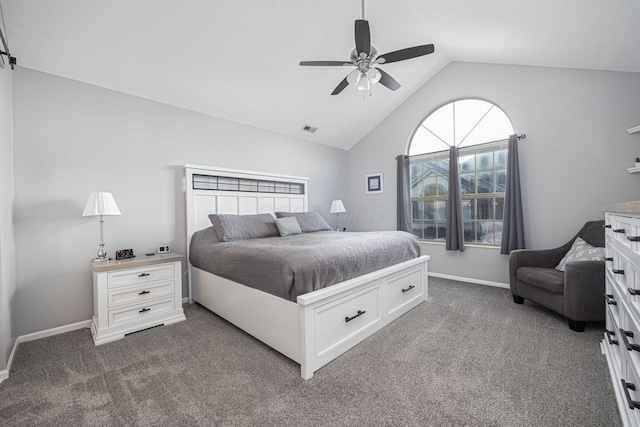 carpeted bedroom with ceiling fan and vaulted ceiling