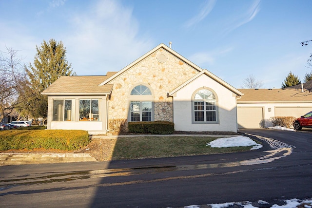 ranch-style home featuring a garage