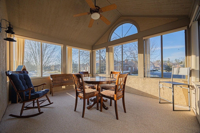 sunroom featuring ceiling fan and lofted ceiling