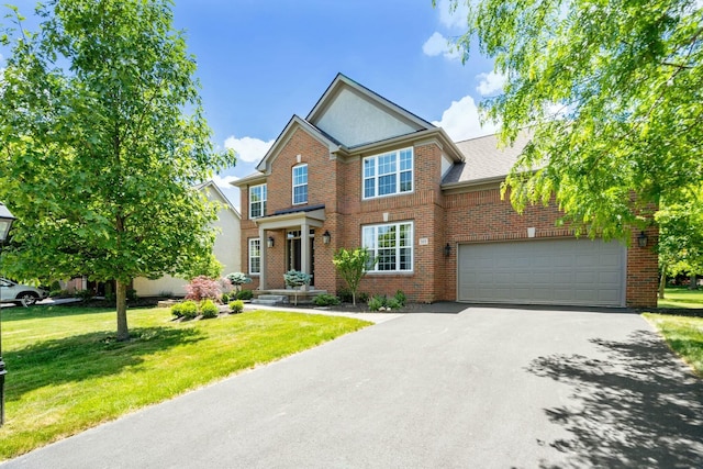 view of front facade with a garage and a front yard