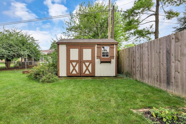 view of outbuilding featuring a lawn