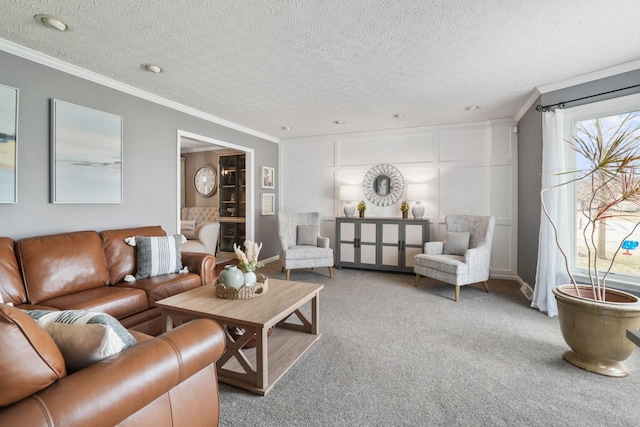 living room featuring ornamental molding, carpet flooring, and a textured ceiling