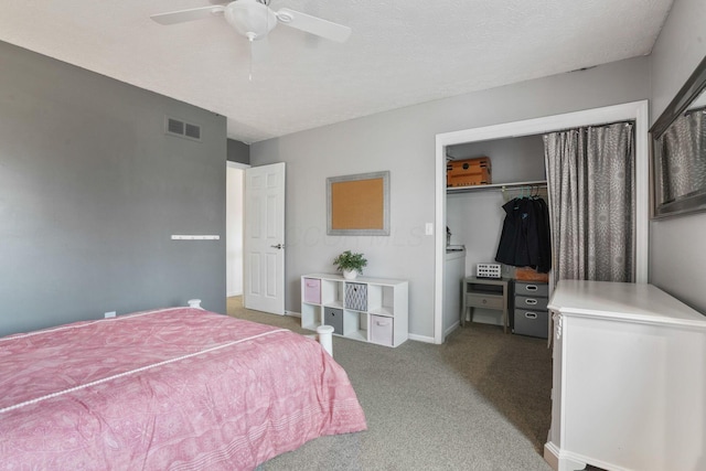 carpeted bedroom with a textured ceiling, a closet, and ceiling fan