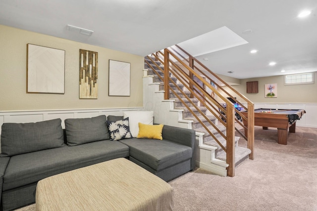 carpeted living room with pool table