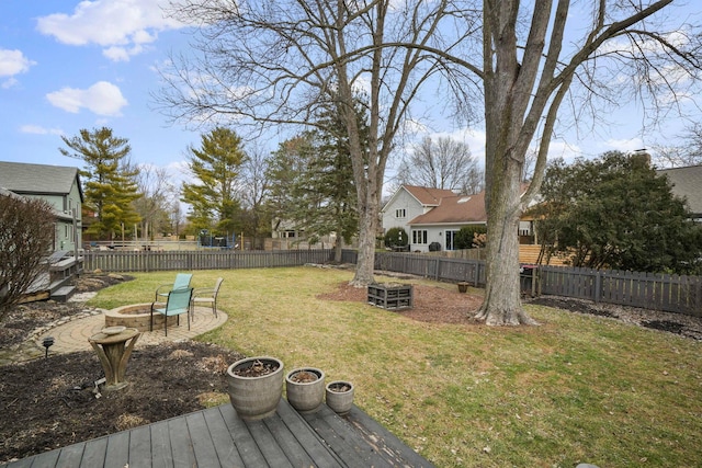 view of yard with a fire pit