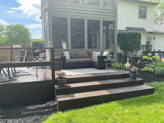 wooden deck with an outdoor hangout area and a sunroom