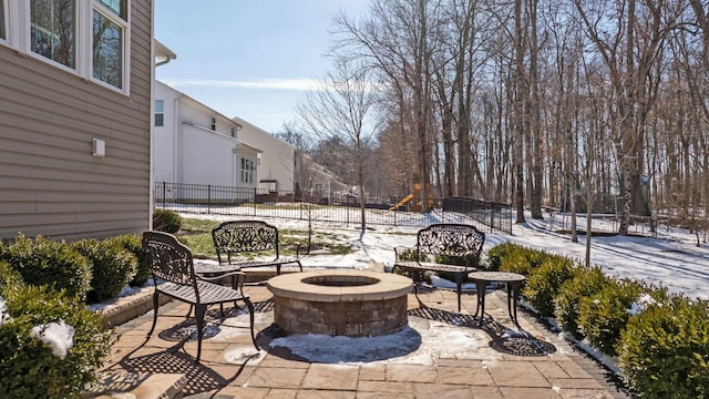 view of patio / terrace featuring a fire pit