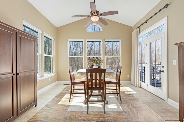 dining area featuring ceiling fan, vaulted ceiling, and a healthy amount of sunlight