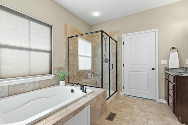 bathroom featuring vanity and plus walk in shower