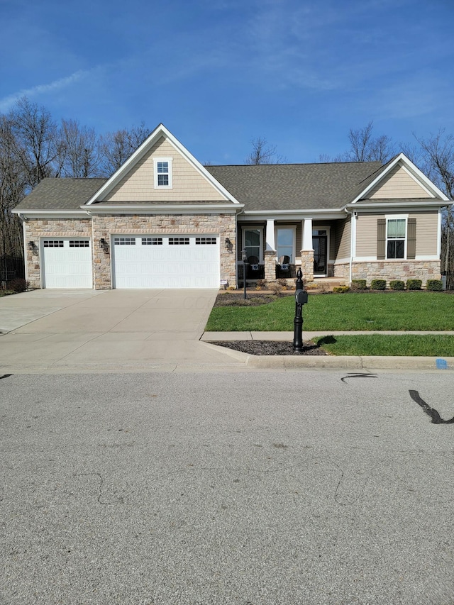 view of front facade featuring a garage and a front lawn