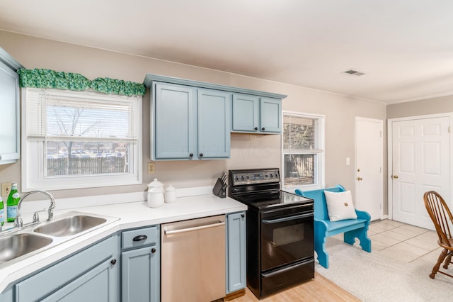 kitchen featuring stainless steel dishwasher, sink, black electric range, and a wealth of natural light