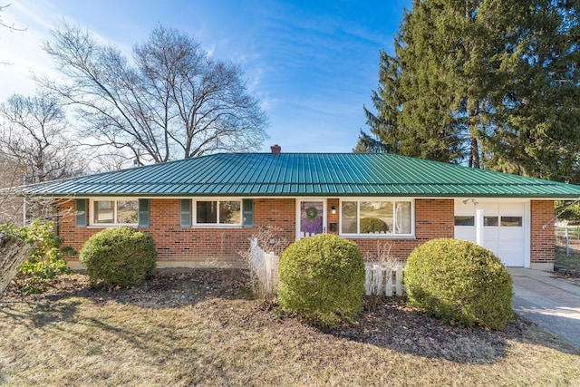 single story home featuring a garage