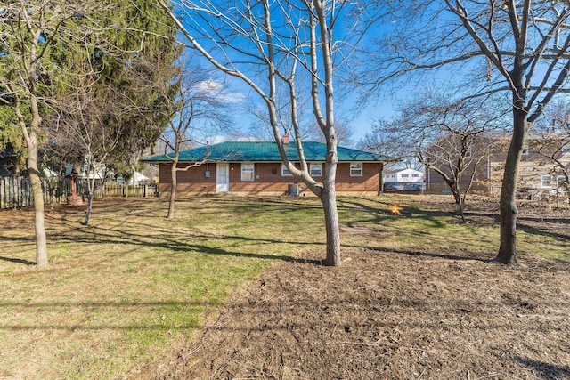 ranch-style house with a front lawn