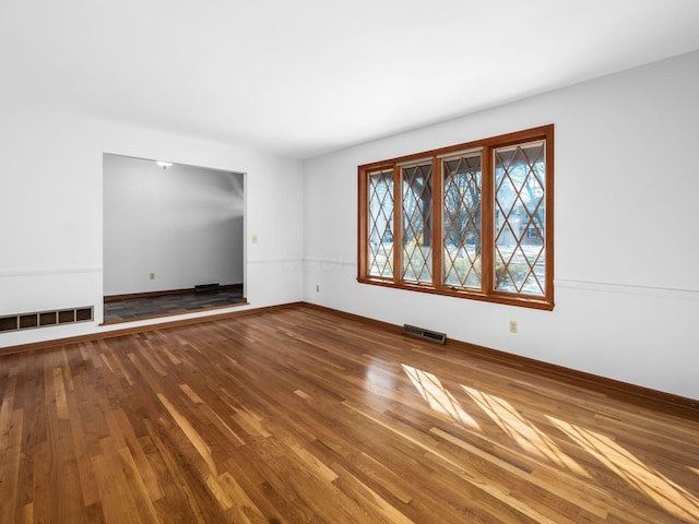 spare room featuring hardwood / wood-style flooring