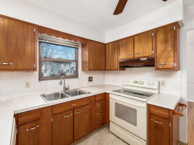 kitchen featuring sink, electric range, decorative backsplash, and ceiling fan