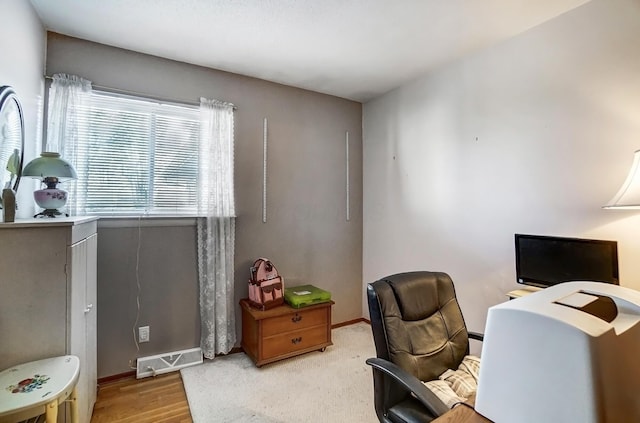 office area with light hardwood / wood-style flooring