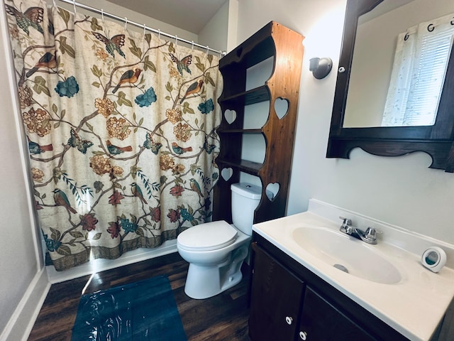 bathroom featuring vanity, hardwood / wood-style floors, curtained shower, and toilet