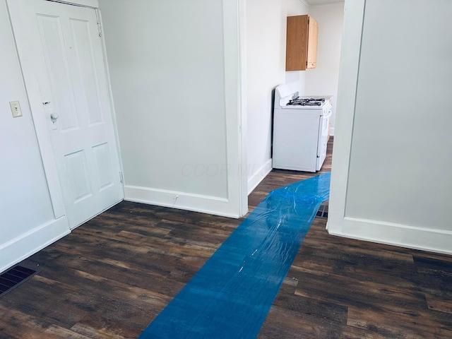 hall with dark hardwood / wood-style flooring